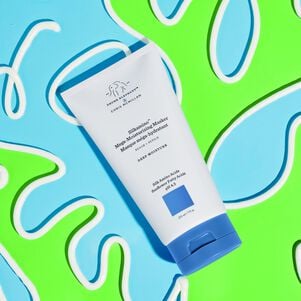 Silkamino Mega-Moisturizing Masker laid flat on a blue and neon green background with texture drawn around the bottle in a squiggly design