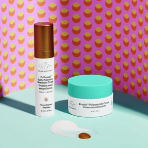 D-Bronzi and Protini Cream standing upright with product texture in front