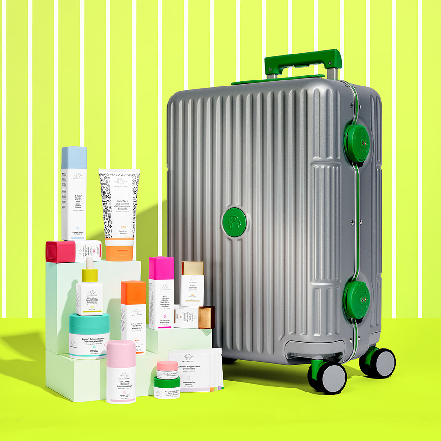Products standing on top of a mint green stand in front of Trunk 8.0, in front of a lime green striped background
