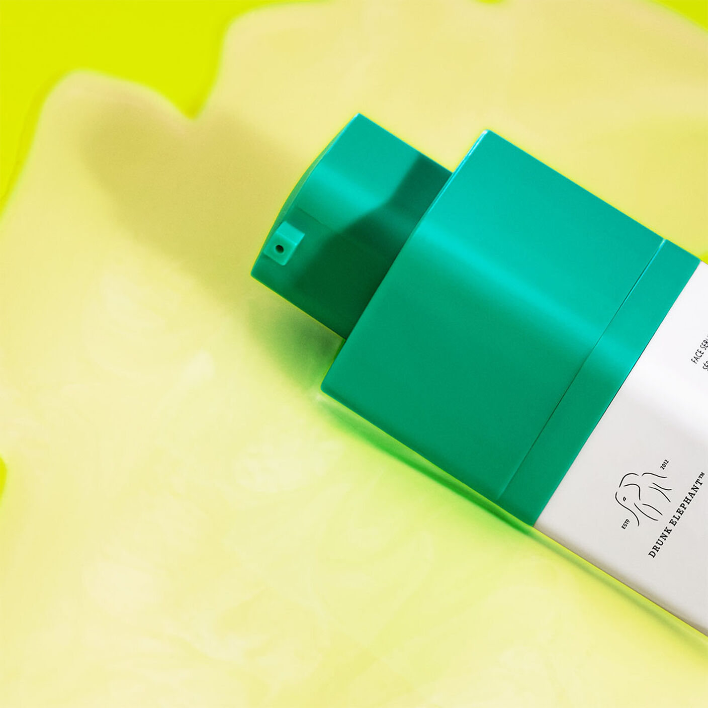 Protini Serum bottle on a yellow background.