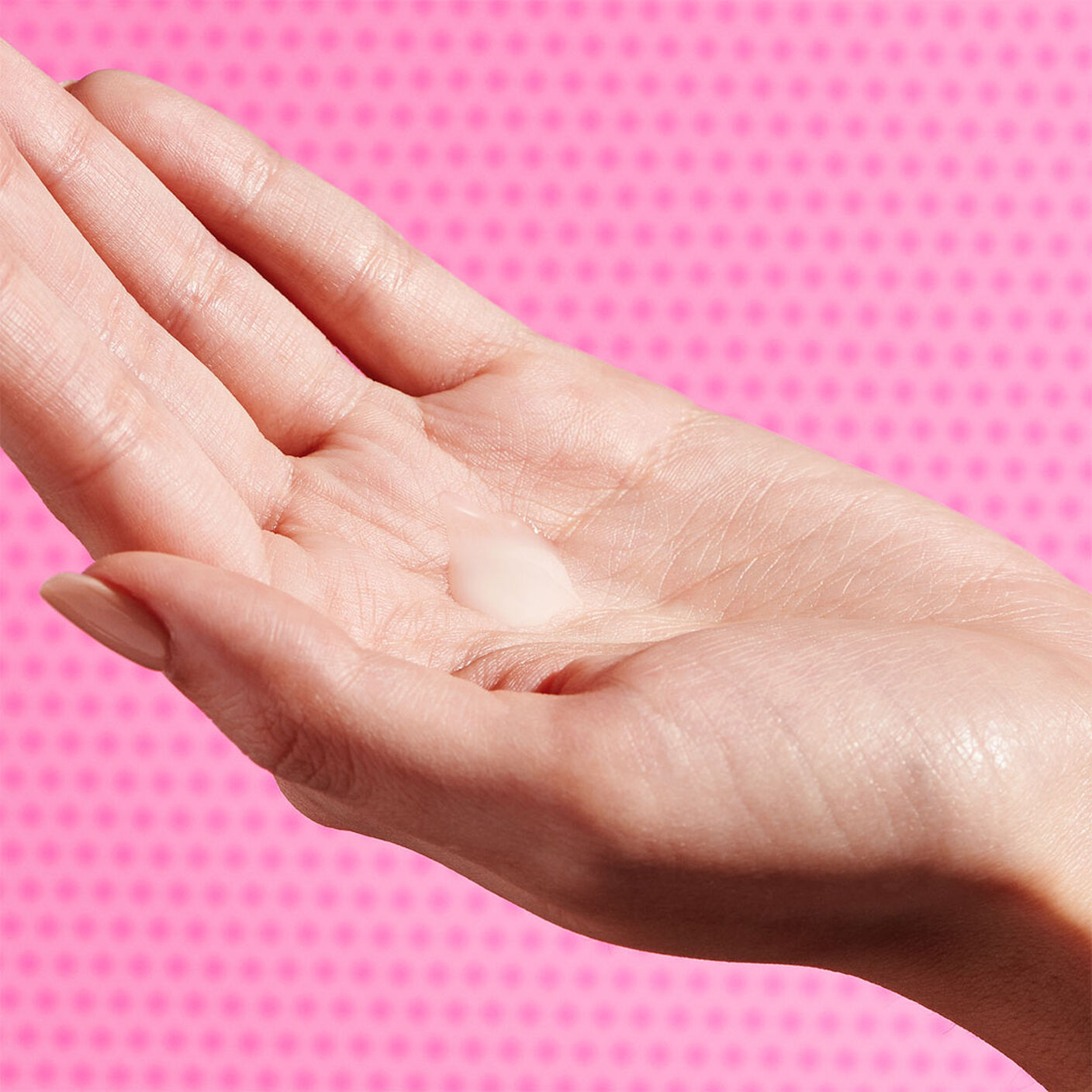 Protini serum goop on the palm of a fair hand. 