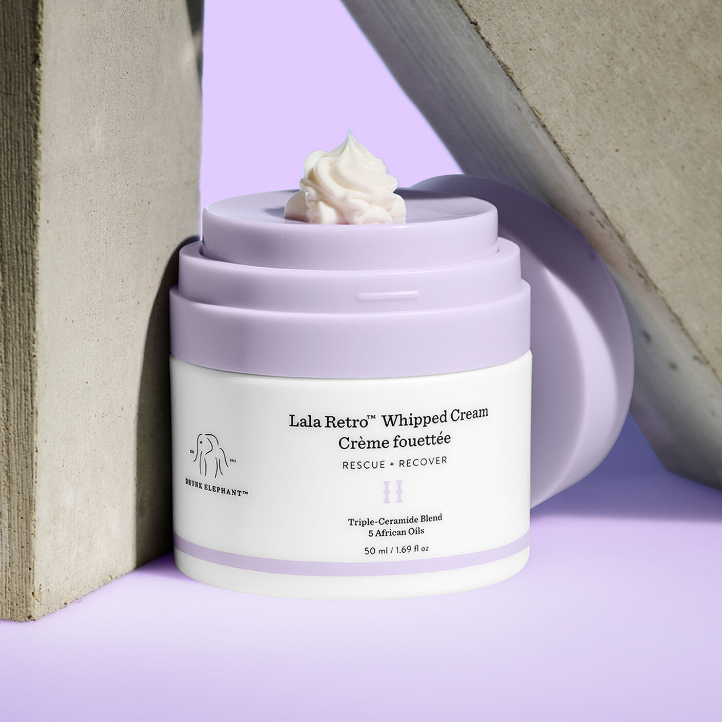 Lala cream with a pump of cream atop the container. 