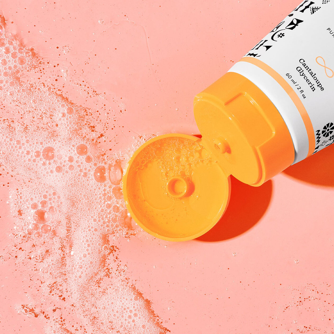  Beste No. 9 Jelly Cleanser with an opened top on a coral background.