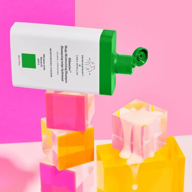 Image of three Silkamino Shampoos laying on top of blocks 