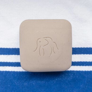 photo of a Juju bar on top of a blue and white striped towel