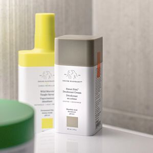 photo of Sweet Pitti deodorant cream in corner along with tangle spray and another, partly obscured, product