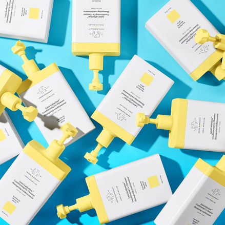 photo of multiple Laini Latherless™ Conditioning Co-Cleanser bottles on blue background