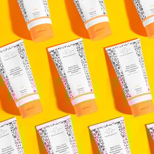 photo of a multiple Beste bottles on a bright orange background