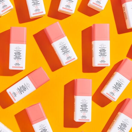 photo of several bottles of C-Tango scattered across an orange background