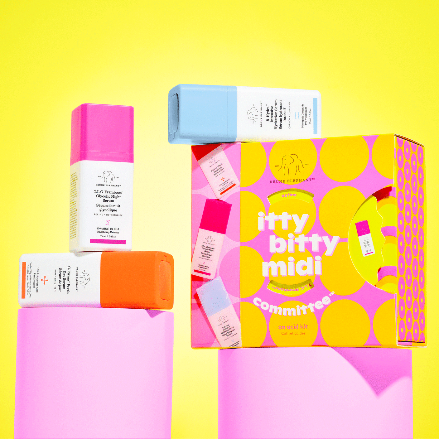 C-Firma (15ml), B-Hydra (15ml), T.L.C Framboos (15ml), and the package on a pink cyclinder prop.