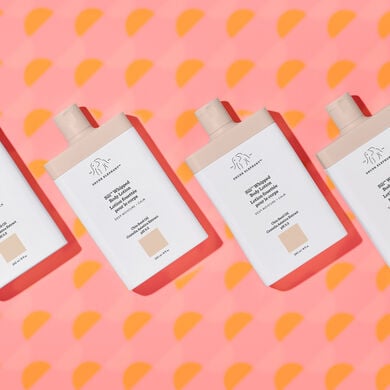 Four Sili Whipped bottles diagonally lined up next to one another