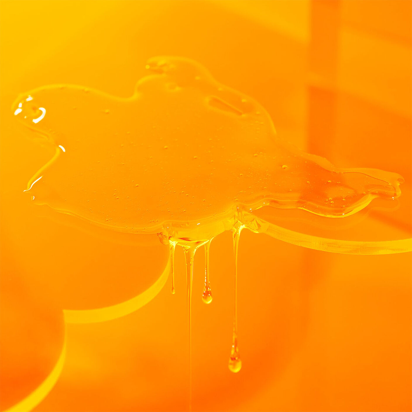 Beste No. 9 Jelly Cleanser texture shot on an orange acrylic cloud prop. 