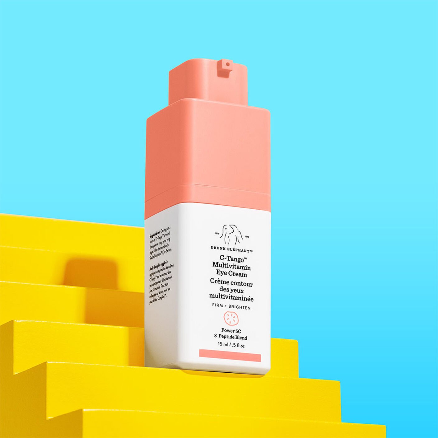     C-Tango Multivitamin Eye Cream on top of a small yellow stair prop on a blue background. 
