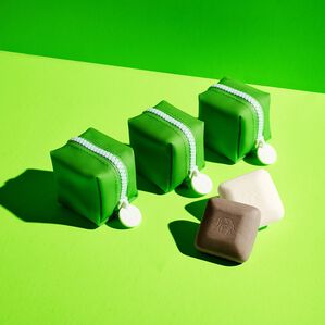 three green baby bar travel duo zipper cases and travel bars displayed on a green background