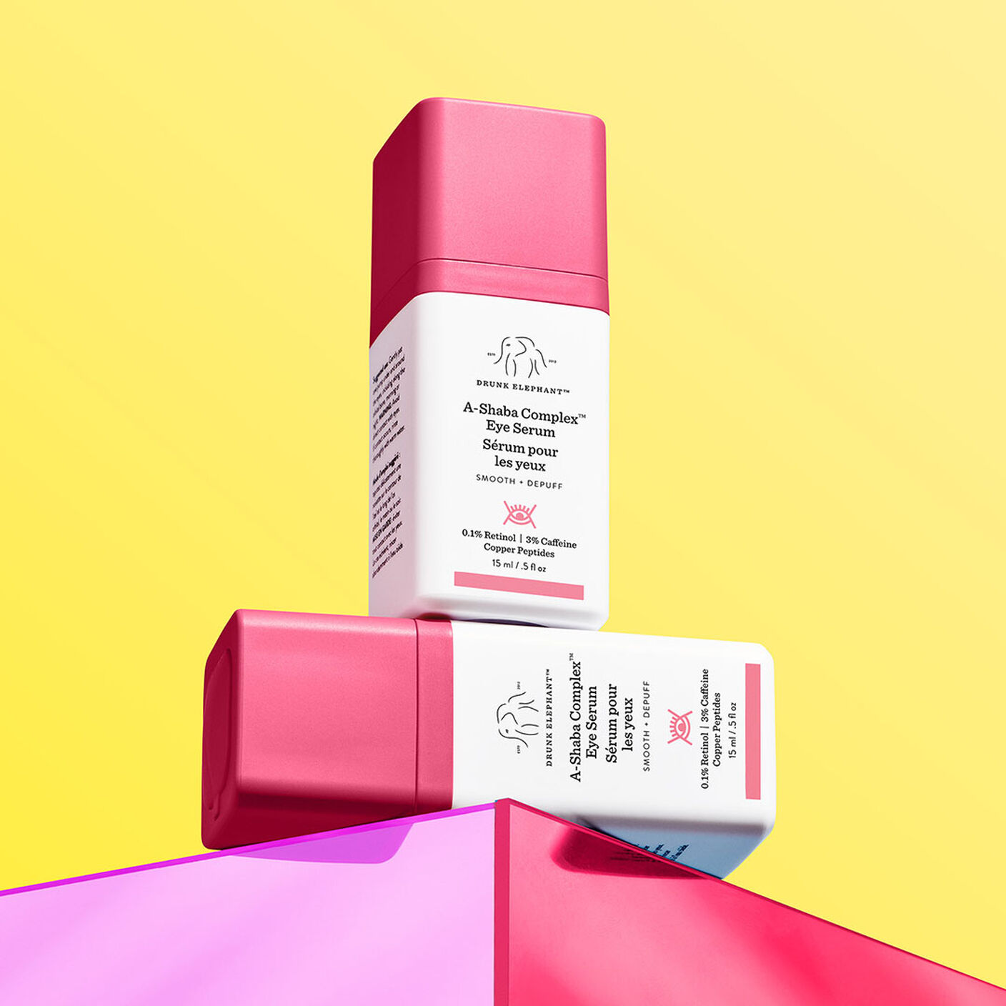 Two A-Shaba Complex Eye Serums on top of eachother on a pink box prop.