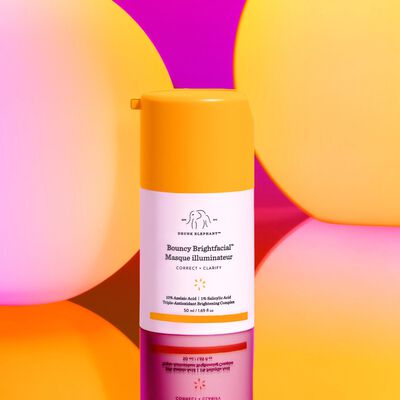 Bouncy Brightfacial™ against pink and orange stylized background