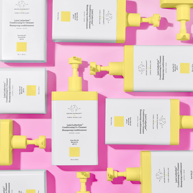 photograph of multiple Laini Latherless™ Conditioning Co-Cleanser bottles on pink background