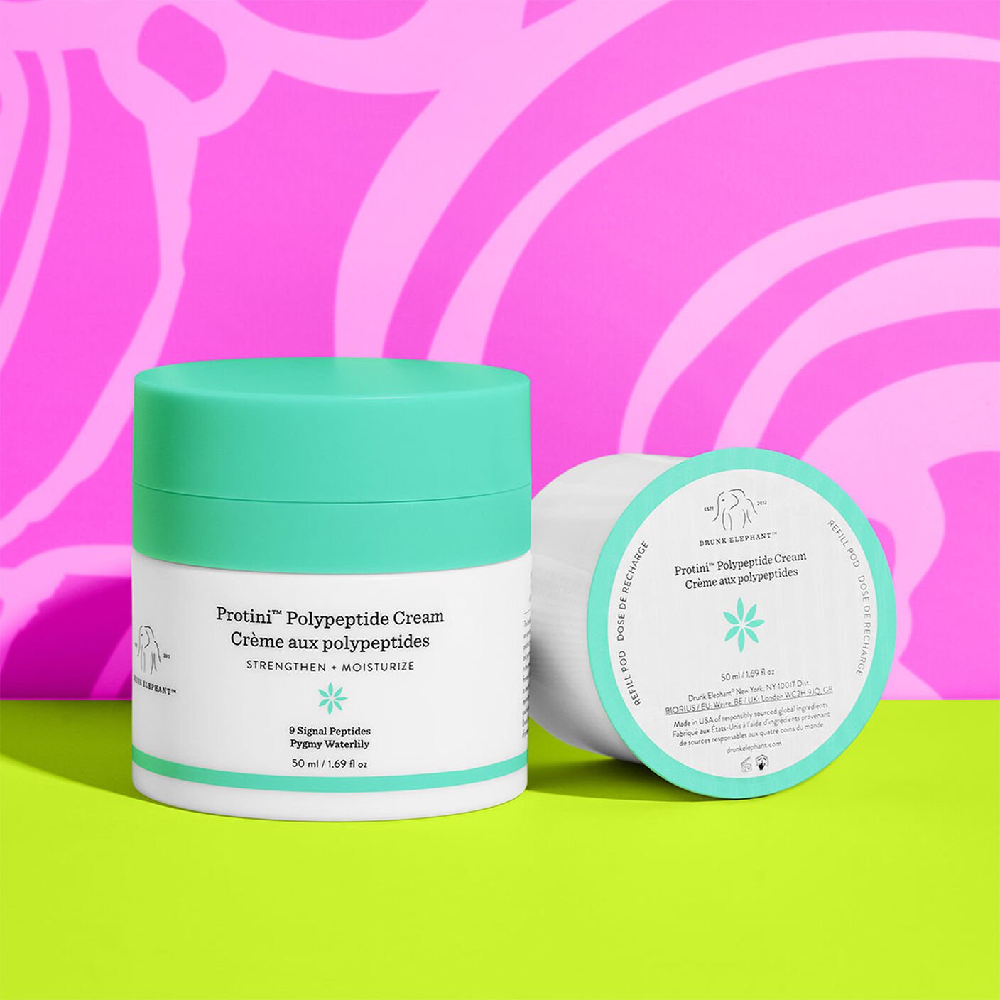 Protini Cream 50ml and the refill beside eachother on a green table. 
