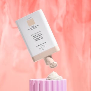 Sili Whipped bottle in mid air with product swatch under