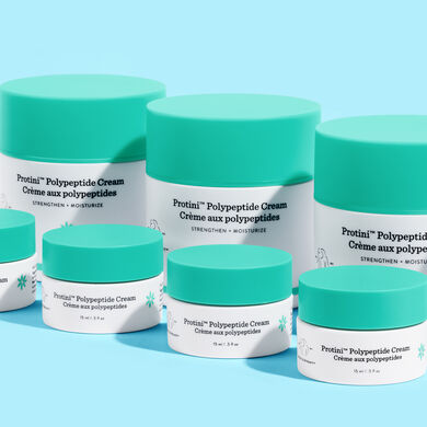 photo of Protini containers on a blue background. some are on their side, labels facing up and others have only the top showing