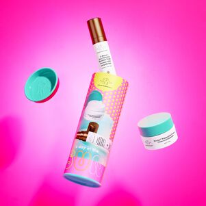 A Day in the Sun kit packaging with Protini Cream and D-Bronzi floating in air