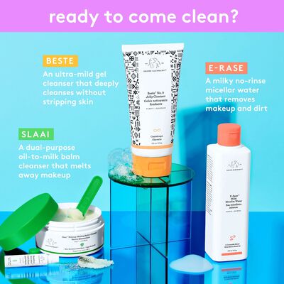 Slaai™ Makeup-Melting Butter Cleanser containers and packaging arrayed in an allternating grid pattern against a green background