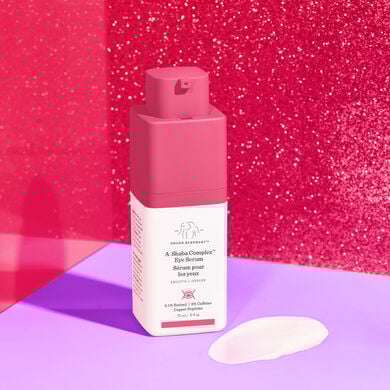 A-Shaba against a pink stylized background with product texture