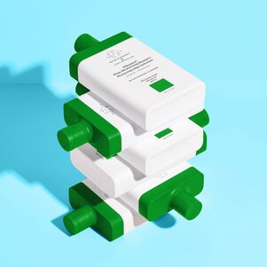 Image of multiple Silkamino Shampoos stacked on top of each other against blue background