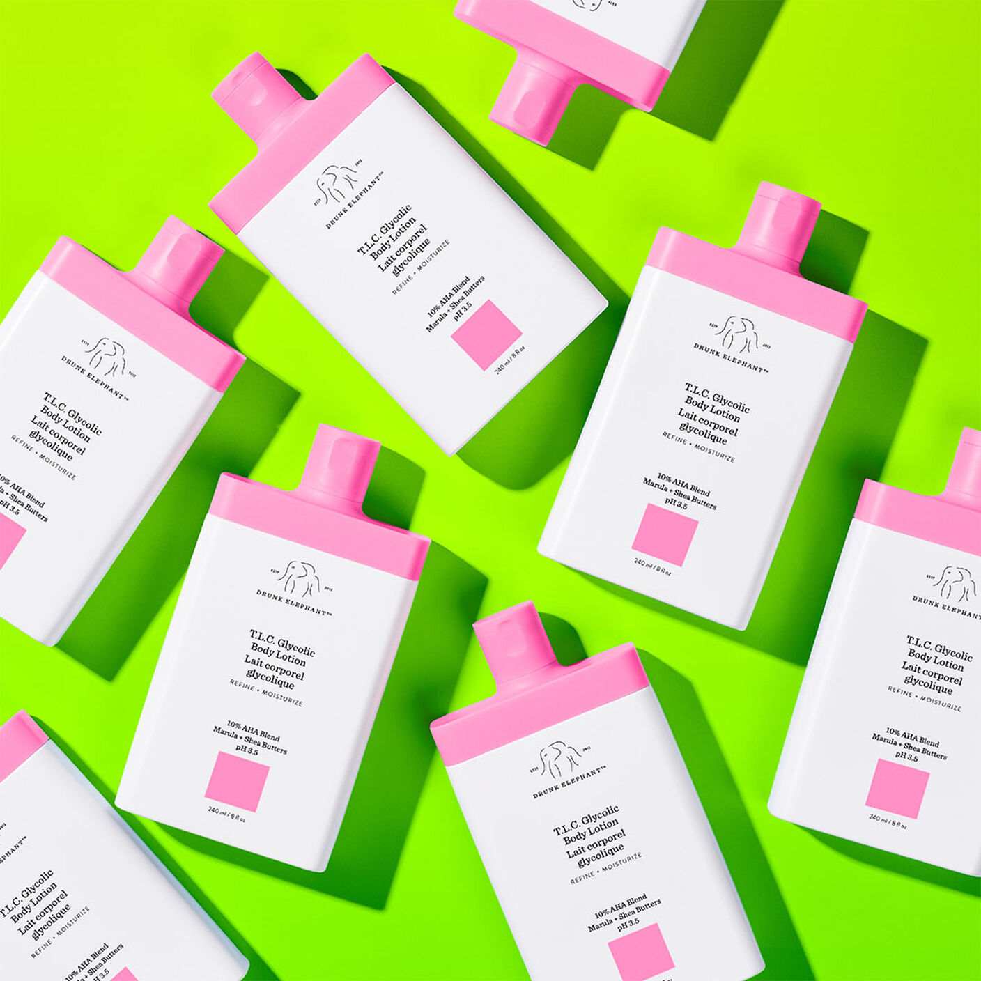 T.L.C Glycolic Body Lotions all over a green table. 