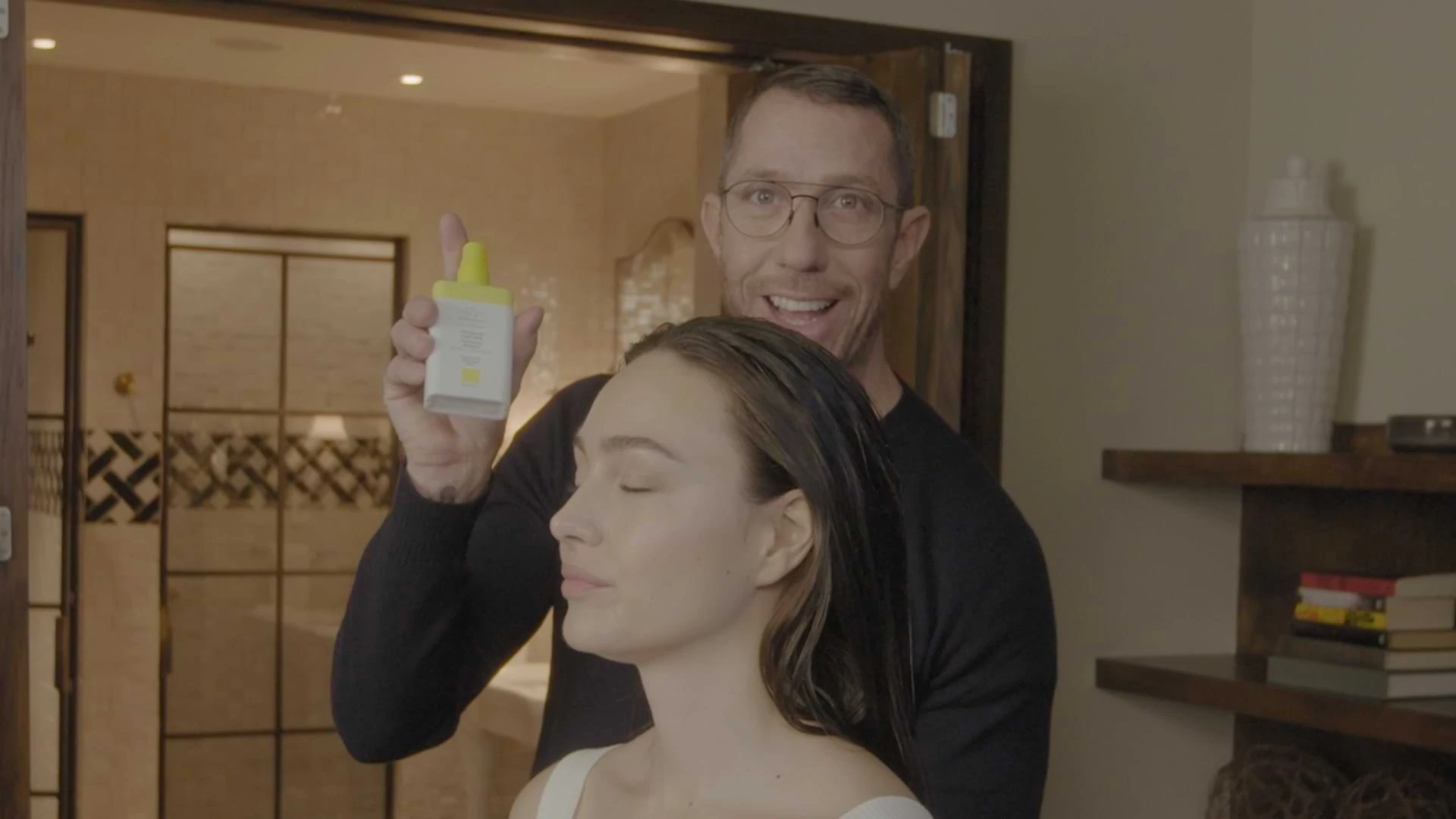 video of celebrity hair stylist Chris McMillan demonstrating scalp scrub on a model