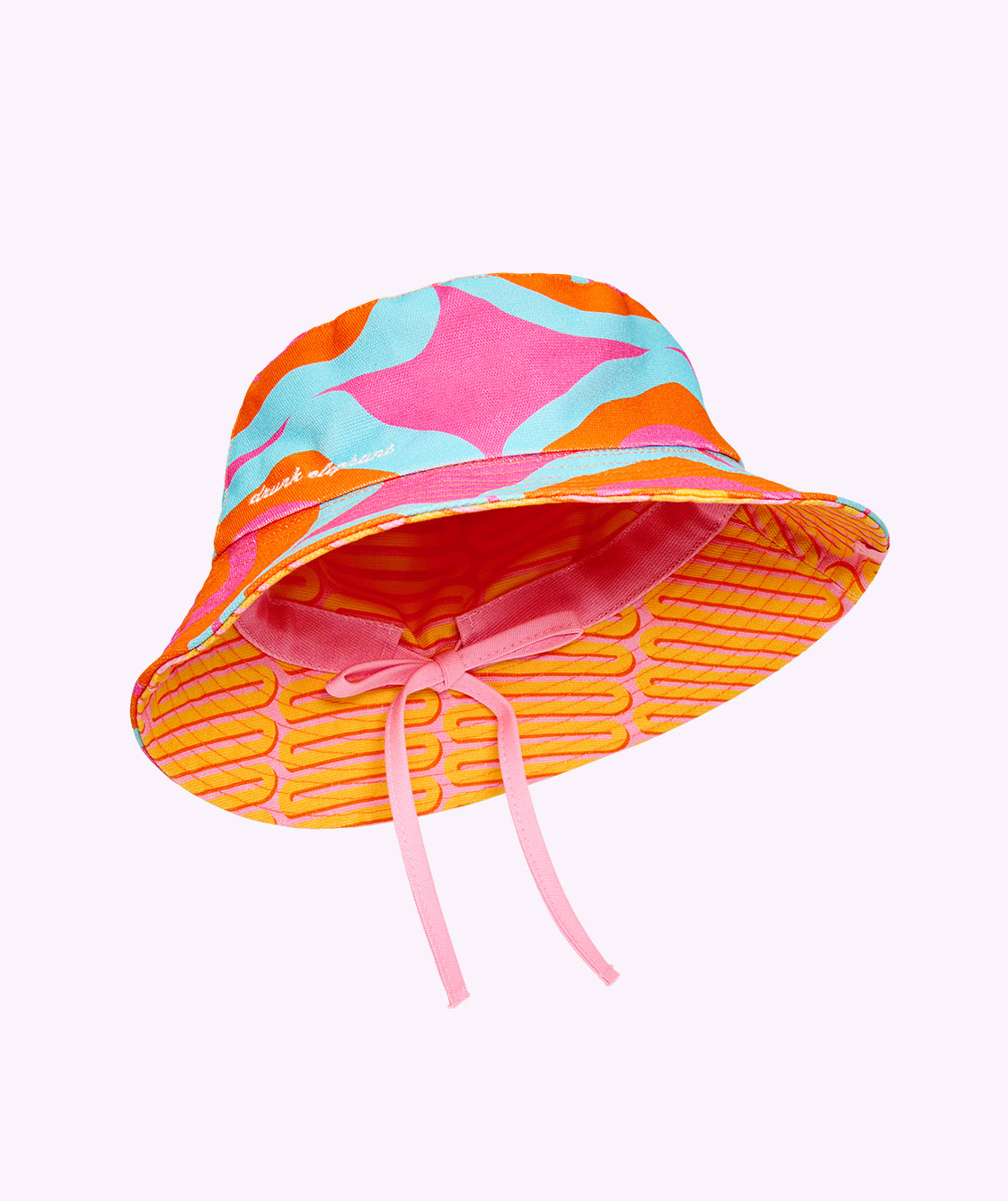 Reversible blue, orange and pink reversible hat revealing the inside pink and orange design on a white background. 